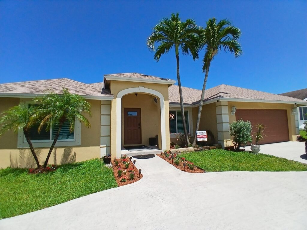 South Florida Real Estate • Luxury Homes Condos • The Martin Group Front of Home at 6640 Plymouth Drive N